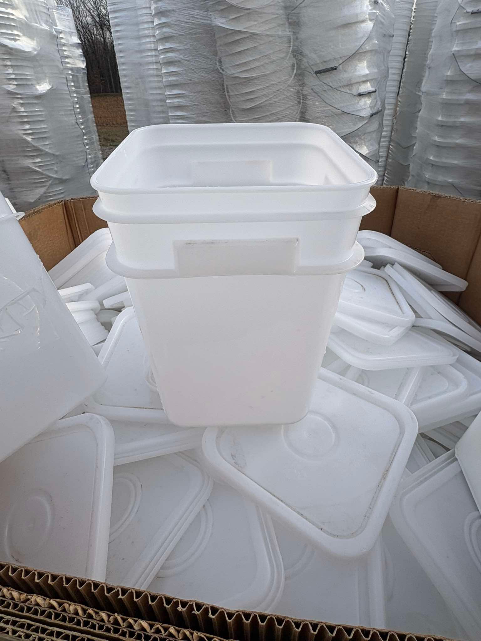 Bulk used square buckets stacked for delivery