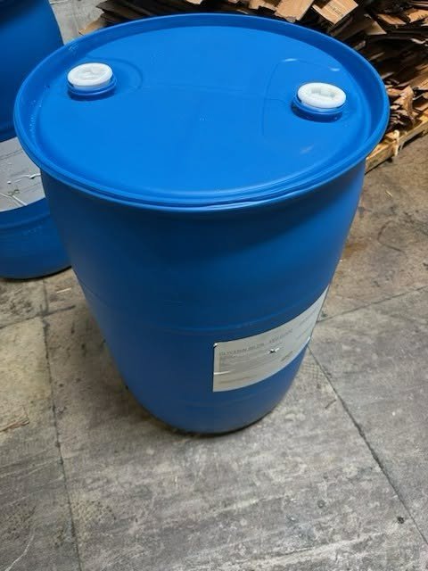 Wholesale 55 gallon drums stacked in full truckload warehouse storage yard